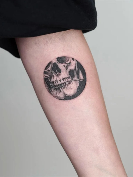 Small Minimalist Skull on Men Arm Tattoo by @julsietattoos
