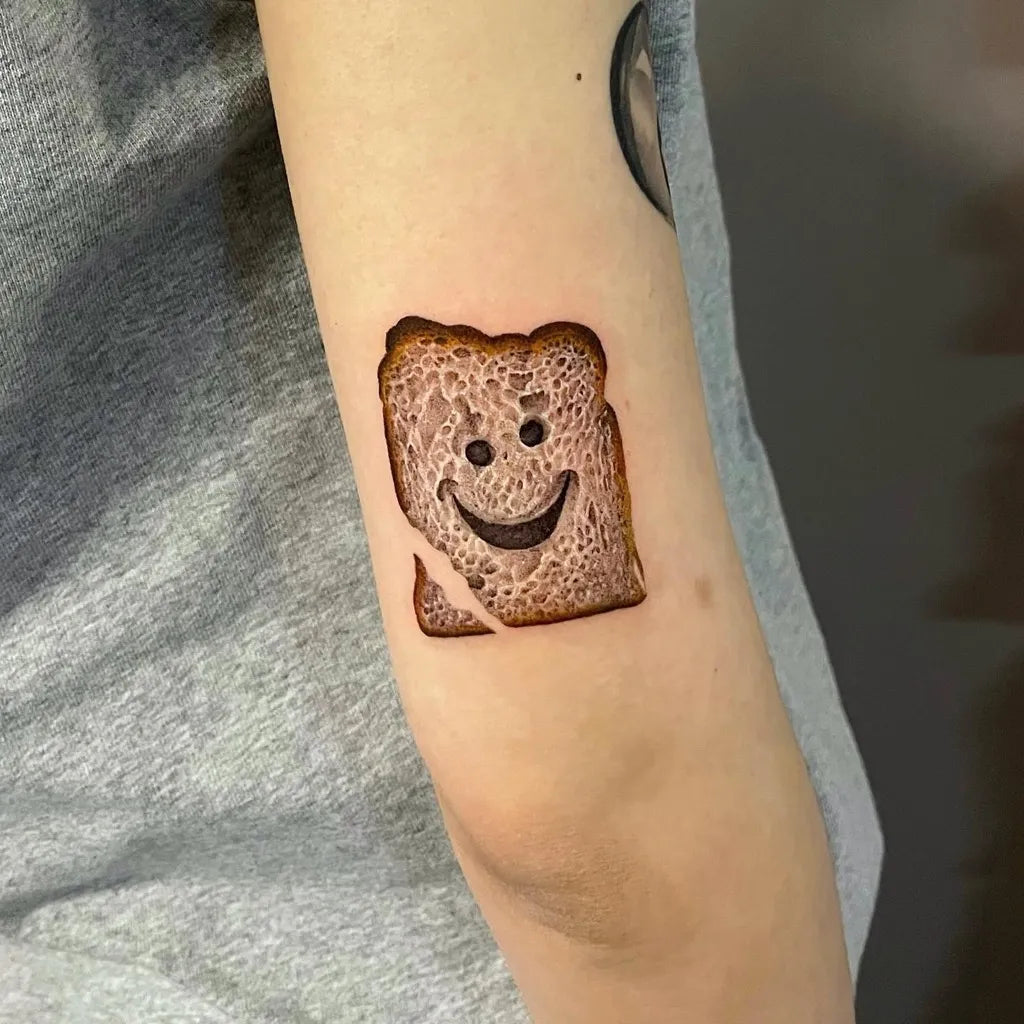 Small Minimalist Smiley Toast on Women Arm Tattoo by @_link13