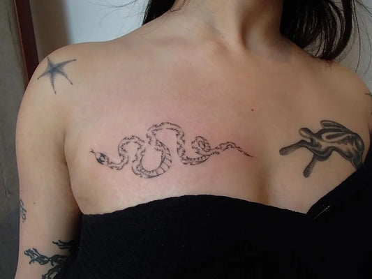 Small Minimalist Snake Star Rabbit on Women Chest Tattoo by @cryyourbest