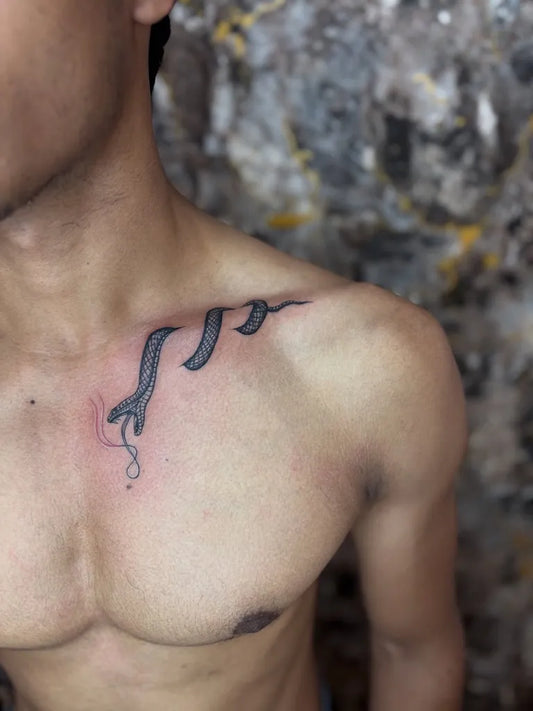 Small Minimalist Snake and Infinity on Men Shoulder Tattoo by @tattoo_by_ram_25