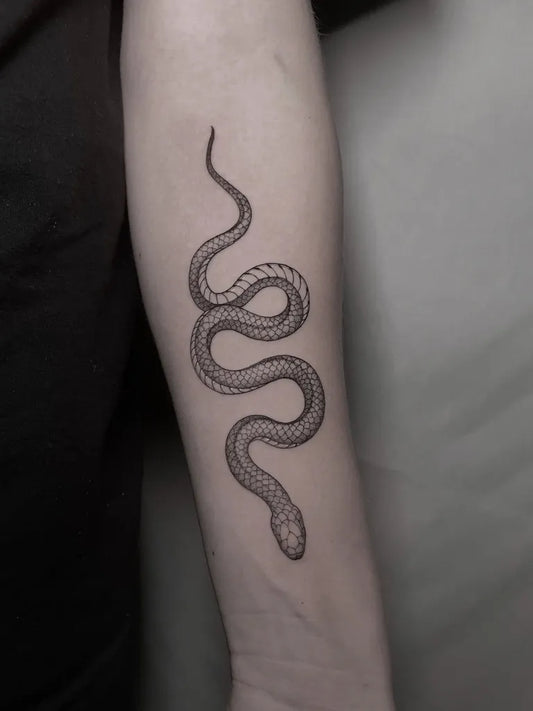 Small Minimalist Snake on Women Arm Tattoo by @deadrabbitink