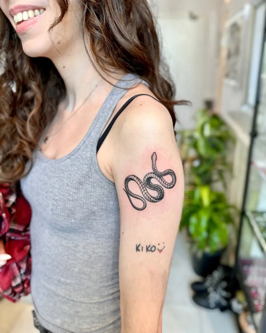 Small Minimalist Snake on Women Arm Tattoo by @gwansoontattoos