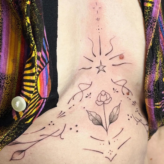 Small Minimalist Star Flower on Women Sternum Tattoo by @raebrooksartistry
