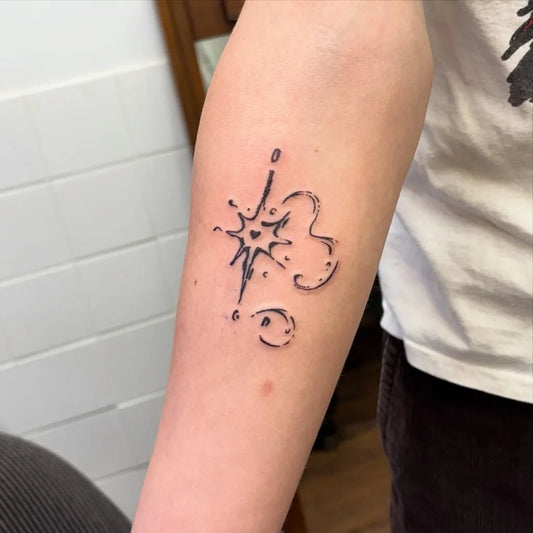 Small Minimalist Star and Heart Tattoo on Women Forearm by @mushypokes