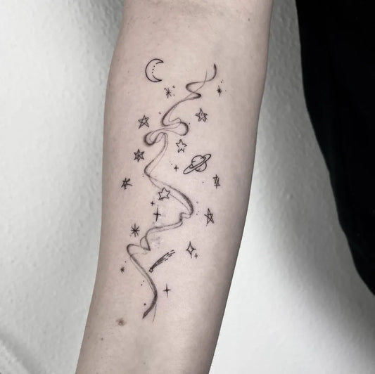 Small Minimalist Star and Moon Tattoo on Women Arm by @pannuc.tattoo