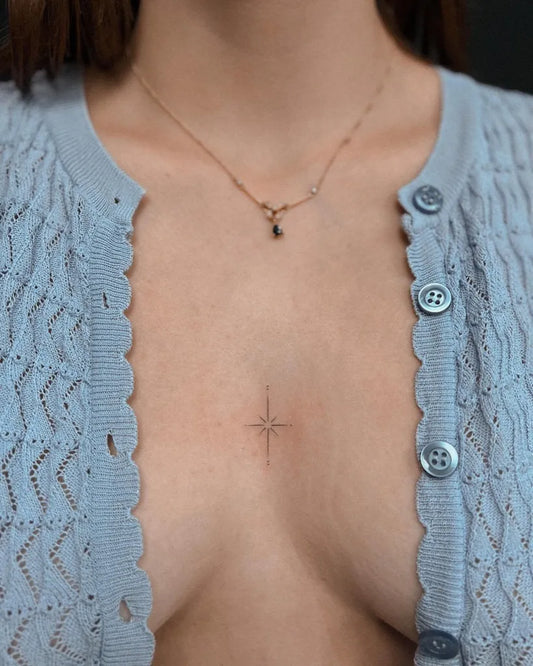 Small Minimalist Star on Women Chest Tattoo by @smallwood.tattoo
