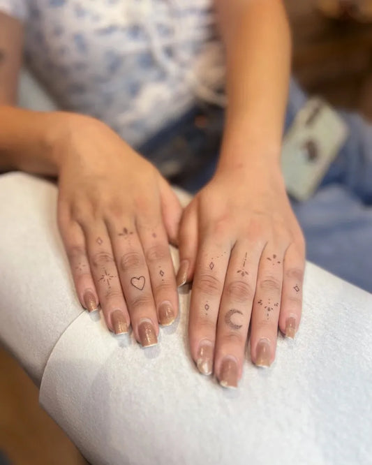 Small Minimalist Stars Heart Moon on Women Fingers Tattoo by @georgiewhitetattoo
