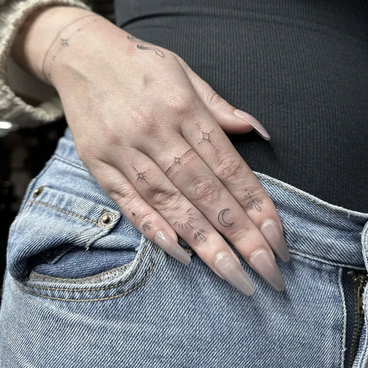 Small Minimalist Stars Moon Rings on Women Fingers Tattoo by @inktherapyfineline
