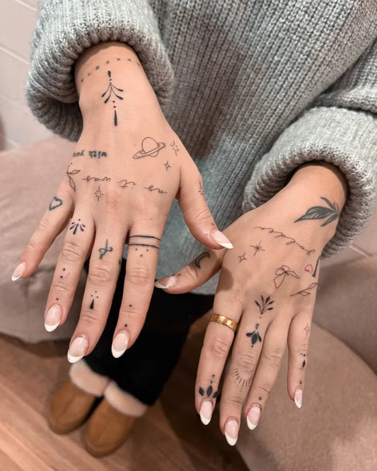 Small Minimalist Stars Planets Symbols on Women Fingers Tattoo by @pinkcosmetictattoo