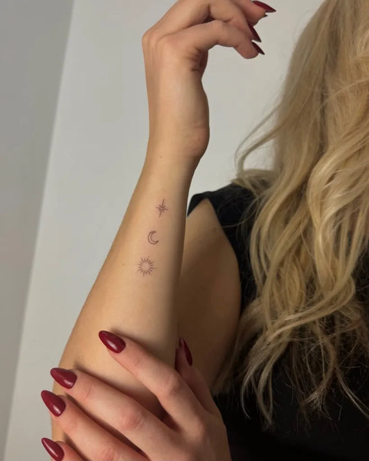 Small Minimalist Sun Moon Circle on Women Forearm Tattoo by @rebitattoo