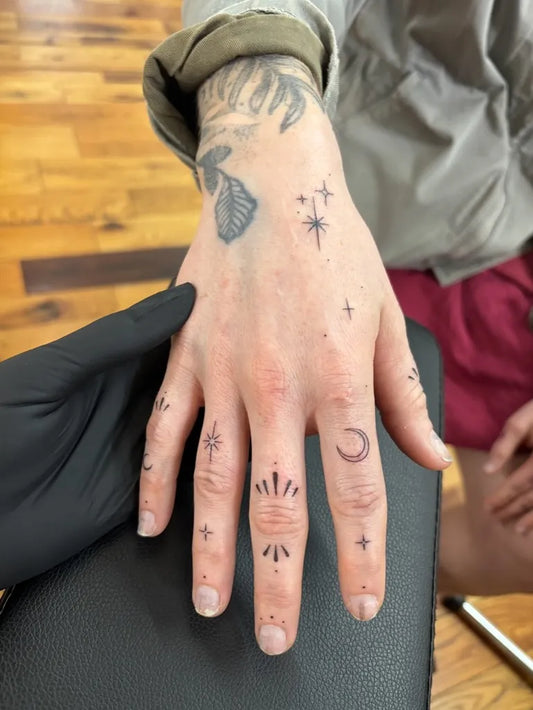 Small Minimalist Sun Moon Stars on Men Fingers Tattoo by @ink.by.kay