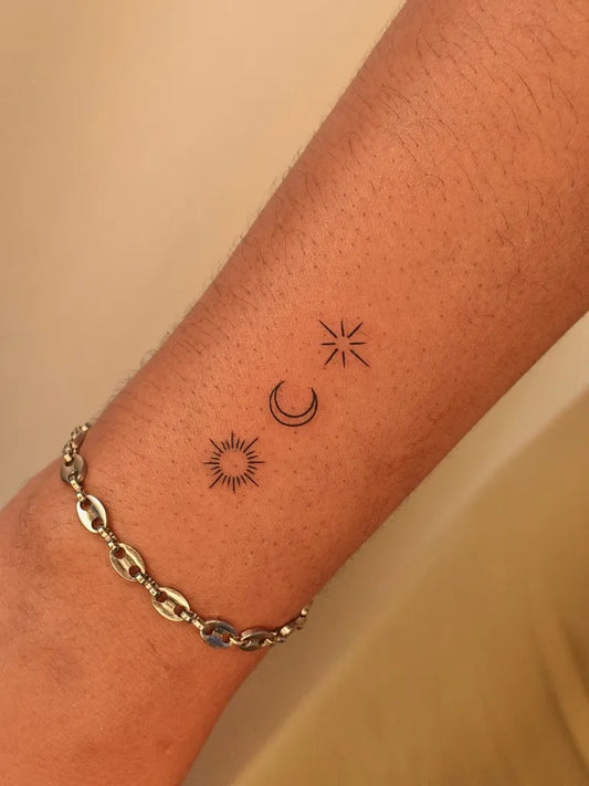 Small Minimalist Sun Moon Stars on Women Wrist Tattoo by @tinytattooinc