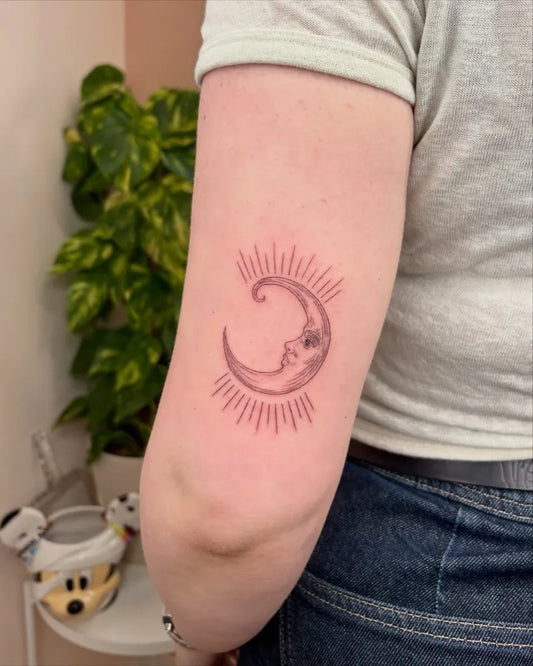 Small Minimalist Sun Moon Tattoo on Women Arm by @sophytattoo