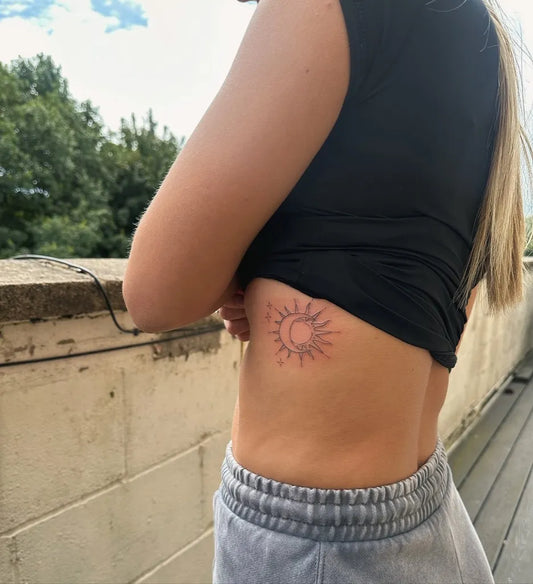 Small Minimalist Sun Tattoo on Women Rib by @hellbaby_ink