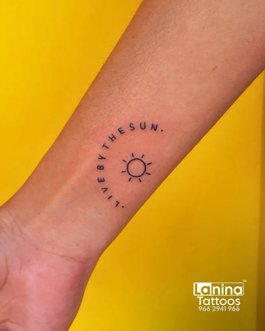 Small Minimalist Sun and Text on Women Wrist Tattoo by @laninatattoos