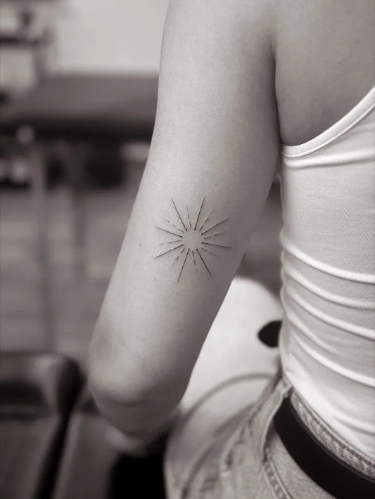Small Minimalist Sun on Women Arm Tattoo by @marinka.tattoo