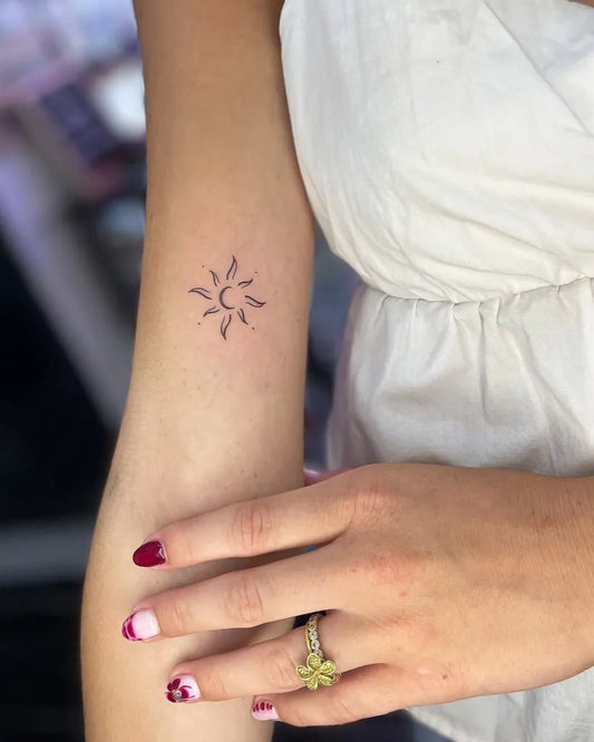 Small Minimalist Sun on Women Arm Tattoo by @yanninkstattoo