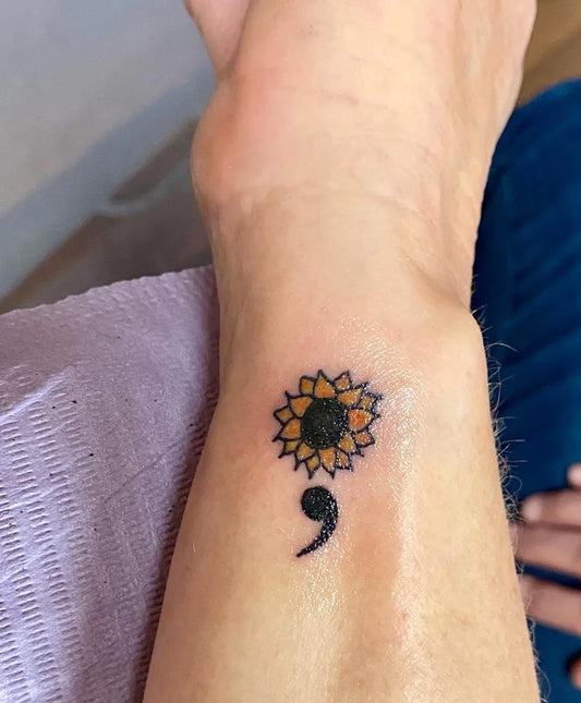 Small Minimalist Sunflower Semicolon on Women Wrist Tattoo by @wolfegirltattoos