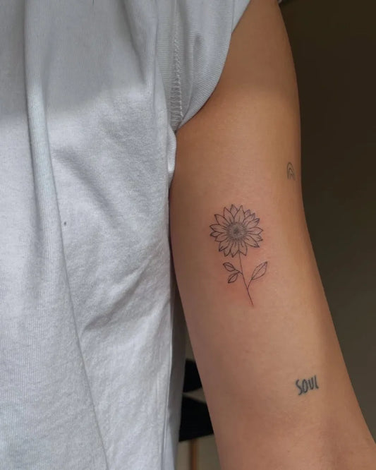 Small Minimalist Sunflower with Leaf and Soul Text on Women Arm Tattoo by @just.poked