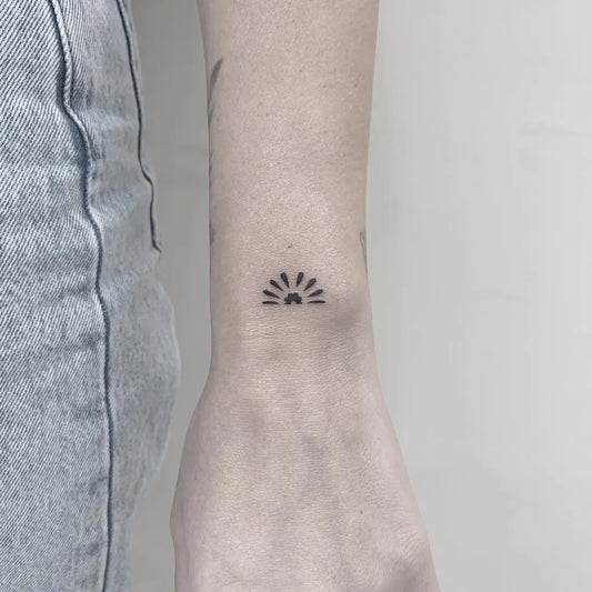 Small Minimalist Sunrise on Women Wrist Tattoo by @micro_man_