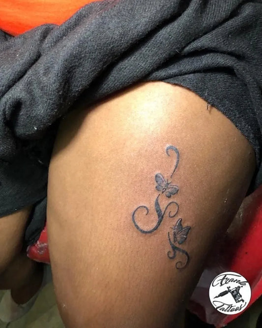 Small Minimalist Swirls Butterflies on Women Thigh Tattoo by @claatyfranklin
