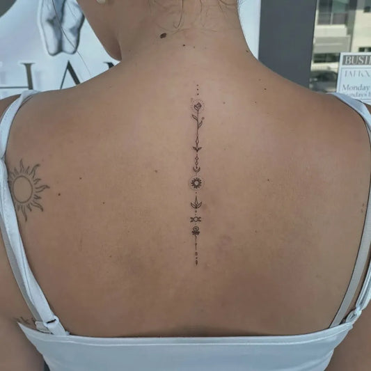 Small Minimalist Symbols on Women Spine Tattoo by @ingoodhandstattoos