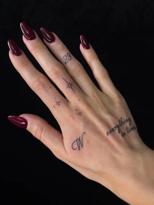 Small Minimalist Text Stars W on Women Hand Tattoo by @gorjessink