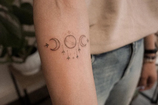 Small Minimalist Three Moons Tattoo on Women Forearm by @sophieelizabethtattoo
