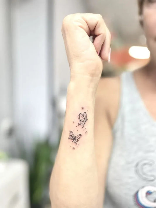 Small Minimalist Two Butterflies on Women Wrist Tattoo by @inkparktattoo_kop