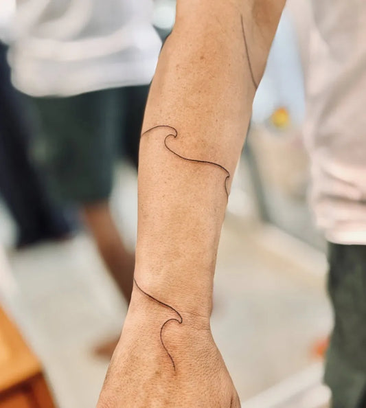 Small Minimalist Wave Tattoo on Men Arm by @bnanatattoo