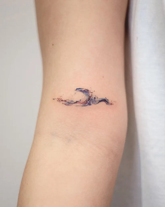 Small Minimalist Wave Tattoo on Women Arm by @handitrip