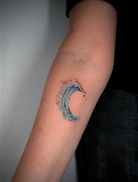 Small Minimalist Wave Tattoo on Women Arm by @nina_tattooer_