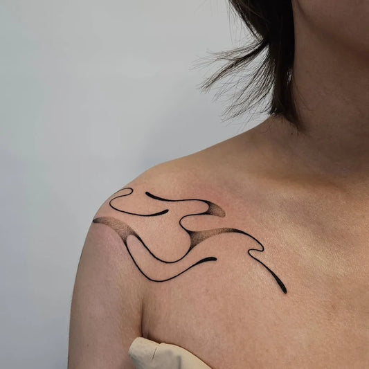 Small Minimalist Wave Tattoo on Women Shoulder by @molebulle