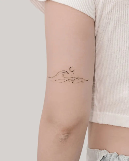 Small Minimalist Waves and Moon on Women Arm Tattoo by @eat_my_pen