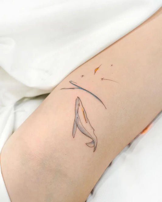 Small Minimalist Whale and Star Tattoo on Women Arm by @tattooist_today_do