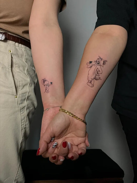 Small Minimalist Winnie the Pooh and Piglet on Couple on Arms Matching Tattoo by @studio_tattoo_koi