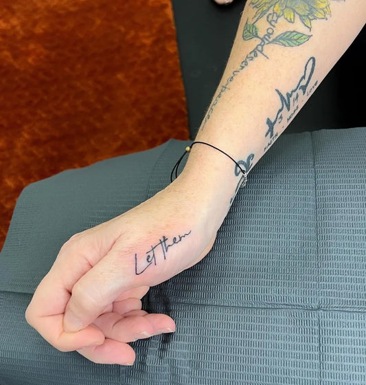 Small Minimalist Word Script on Women Wrist Tattoo by @jamie.transcendbeauty