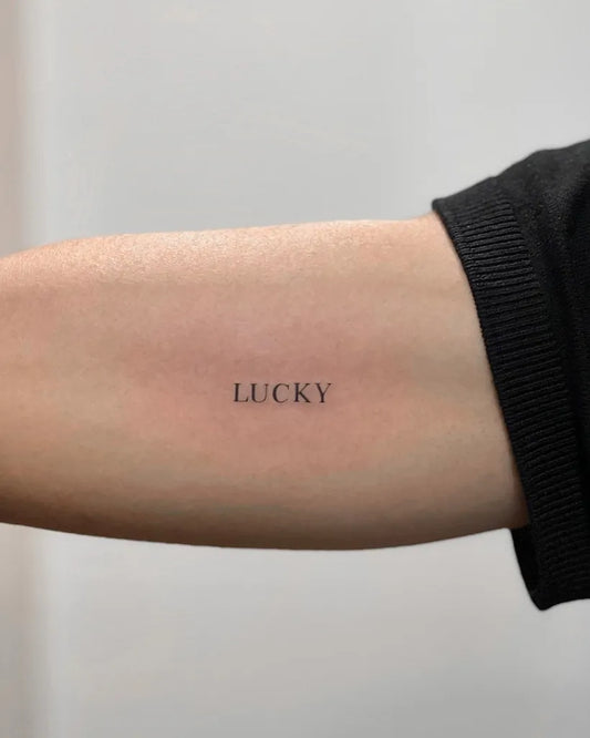 Small Minimalist Word on Women Arm Tattoo by @karntattooer