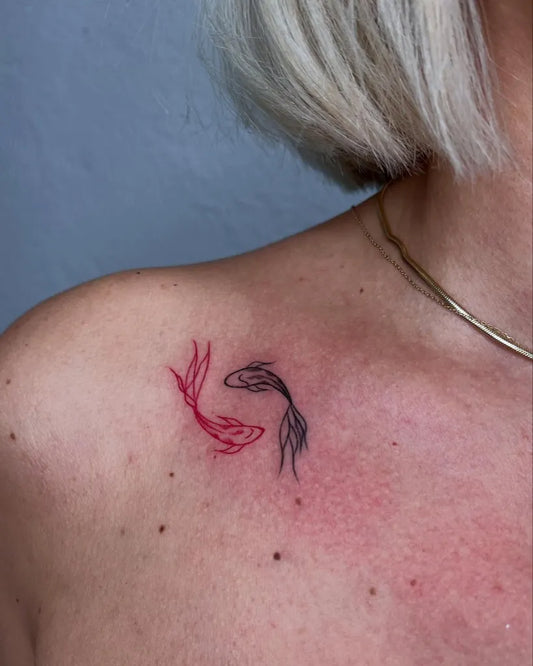 Small Minimalist Yin Yang Fish Tattoo on Women Shoulder by @bee.inktattoo