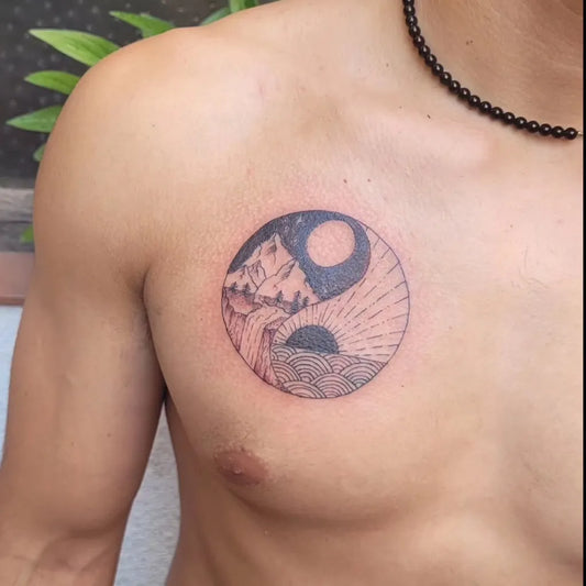 Small Minimalist Yin Yang Mountains on Men Chest Tattoo by @desmadre_tattoo