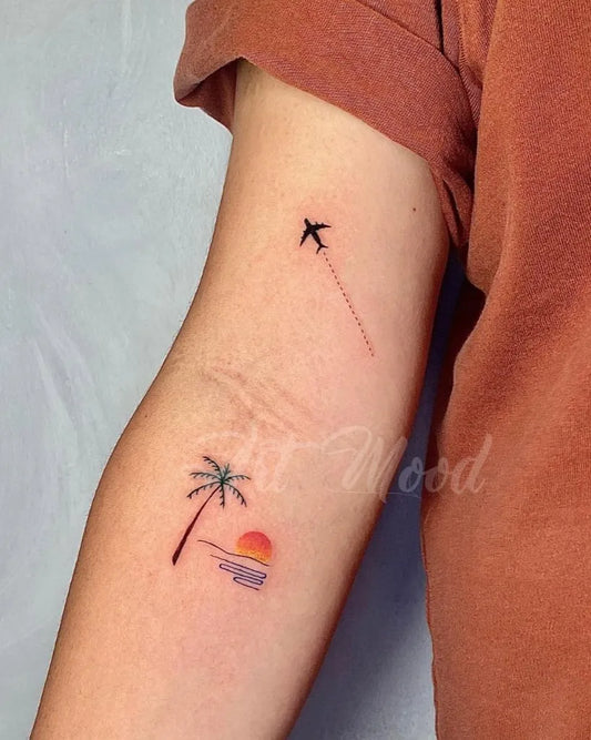 Small Minimalist palm tree sunset airplane on Women Arm Tattoo by @artmoodph