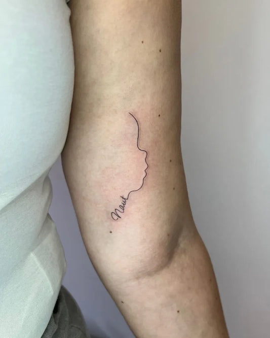 Small Minimalist profile silhouette with name on Women arm Tattoo by @nickymarijnetattoo