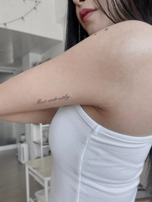 Small Minimalist script word on Women arm Tattoo by @siningtinta