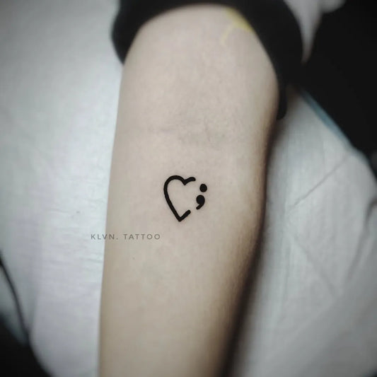 Small Minimalist semicolon heart on Women arm Tattoo by @klvnlpz