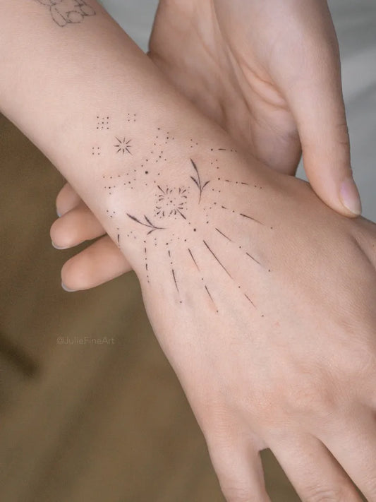 Small Minimalist stars leaves rays on Women wrist Tattoo by @juliefineart