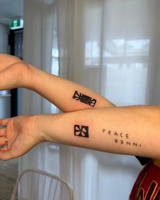 Small Negative Space Chinese Character Peace Tattoo on Women Arm by @stinky.tatts