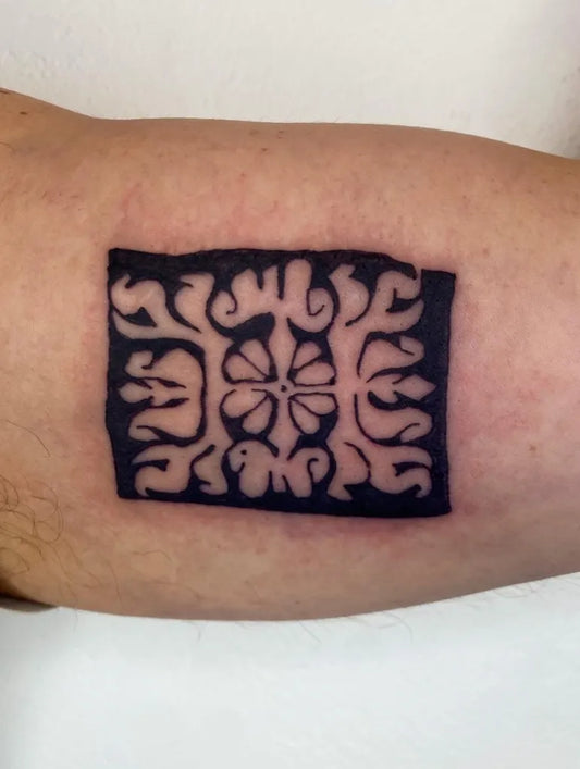 Small Negative Space Hawaiian Floral Motif Tattoo on Men Arm by @shell_station_tattoo