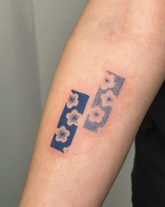 Small Negative Space Hibiscus Flowers Tattoo on Women Arm by @stinky.tatts