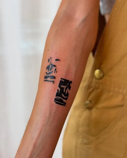 Small Negative Space Japanese Kanji Tattoo on Women Forearm by @stinky.tatts