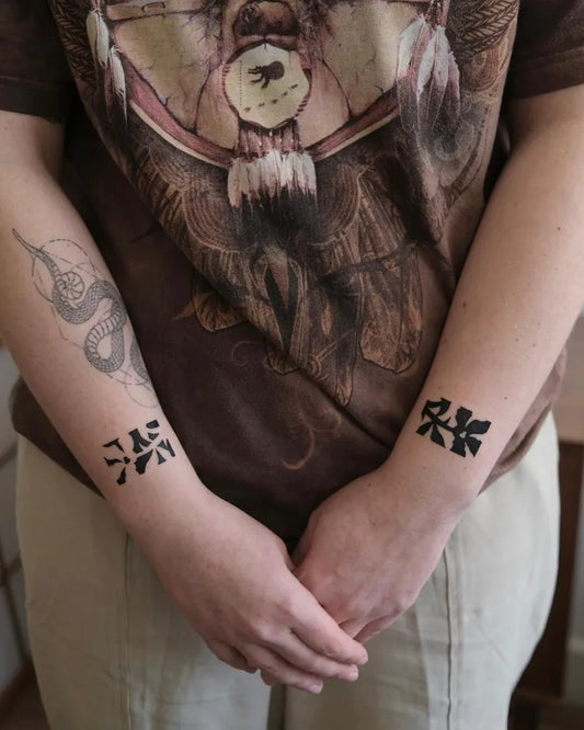 Small Negative Space Snake Kanji Tattoo on Women Forearm by @surreal.lines